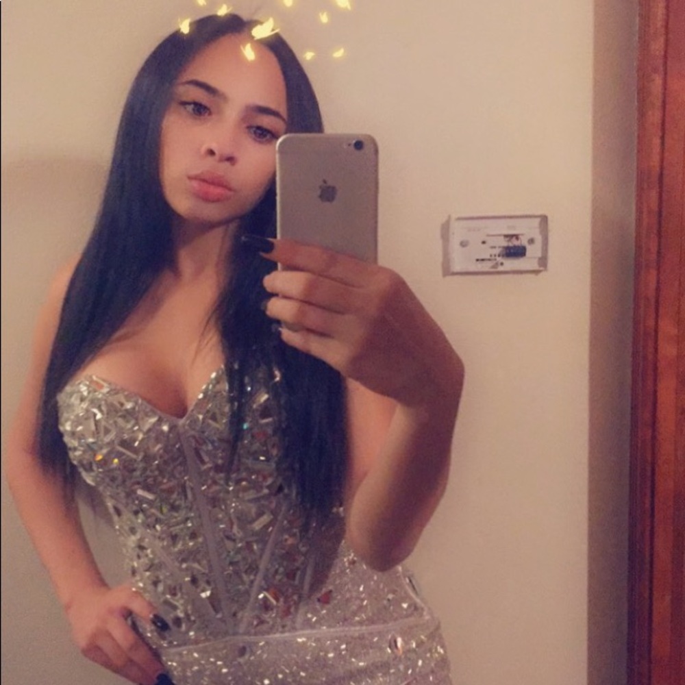 The designer is Sherri Hill. It’s a very fitted!